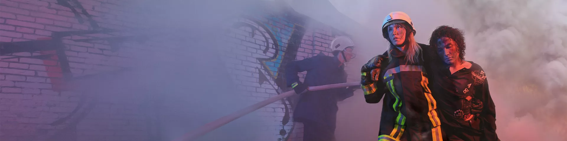 Women firefighters putting off a fire